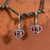 two silver 13 earings with red enamel